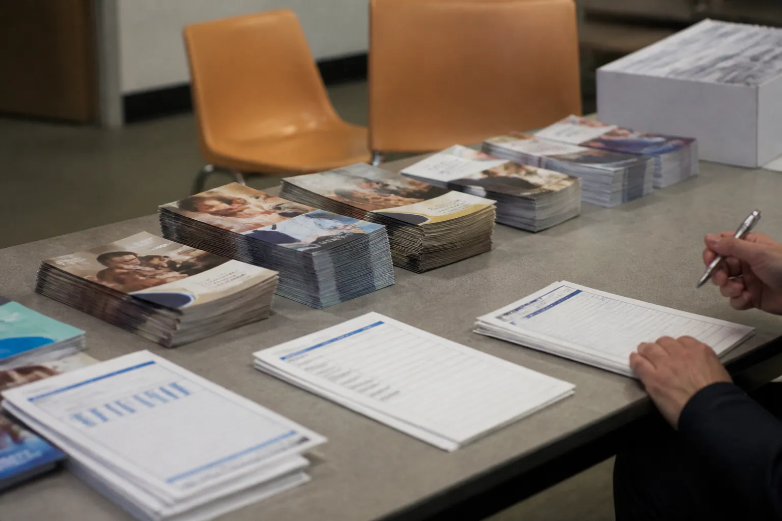 Brochures and payroll deduction pledge materials for Nebraska donations through Give Nebraska arranged on a table in Lincoln.