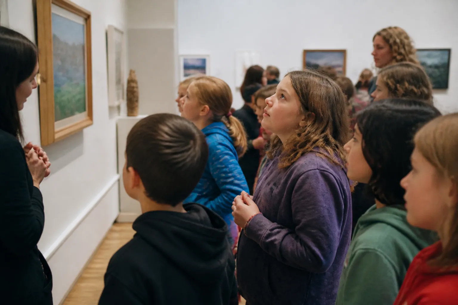Fifth-grade students study artwork inside the Missoula Art Museum during the Fifth Grade Art Experience.