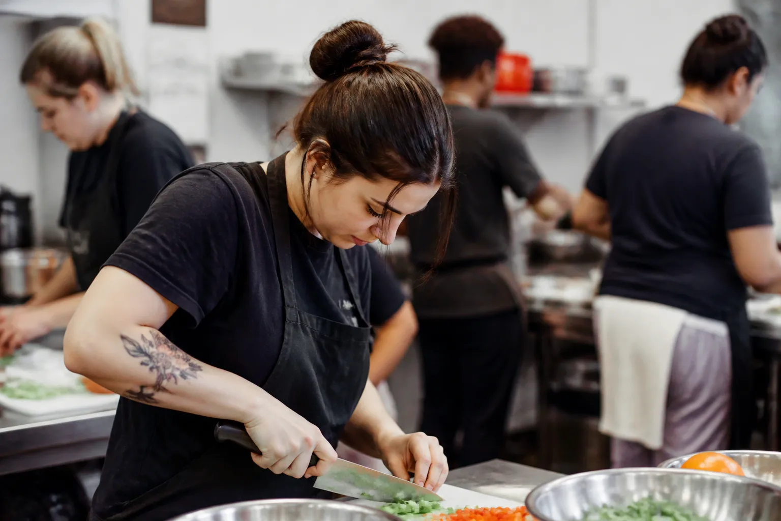 Foster and adopted youth practice hospitality and culinary skills in Whalers Creation’s FAM Treats training session.