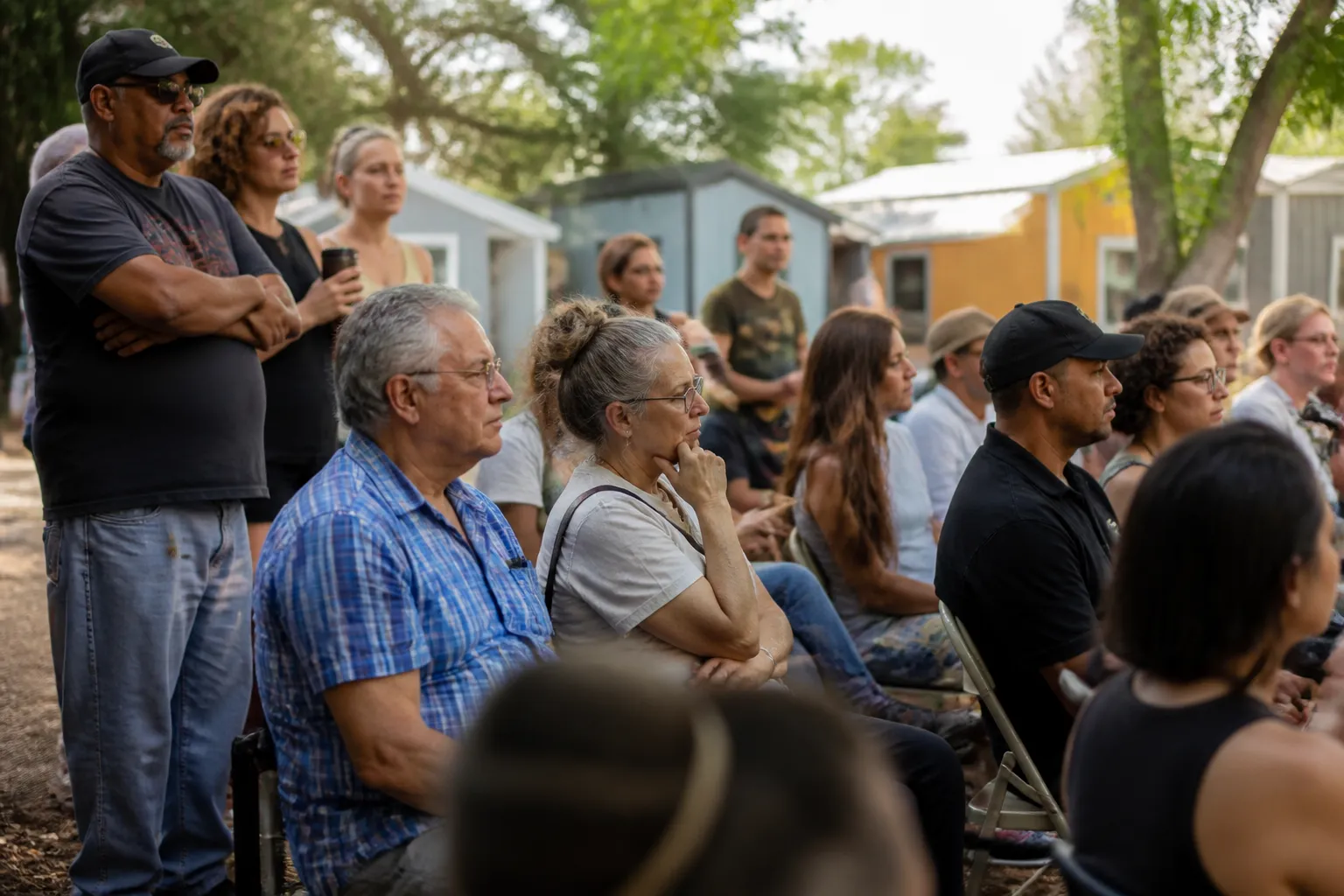 People attend the June 7, 2026 Remember & Reflect Gathering outdoors at Community First! Village in Austin.
