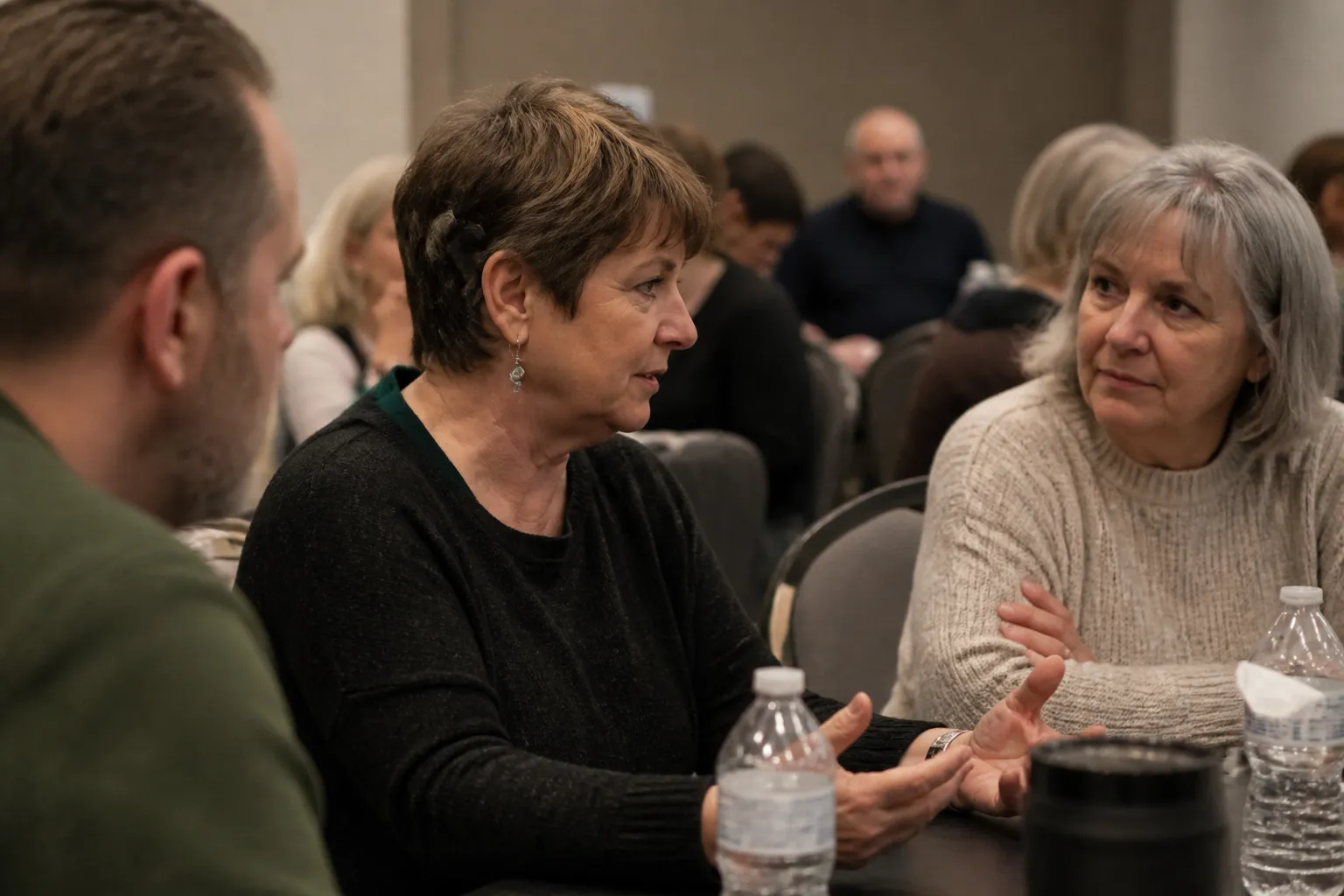 Adult cochlear implant recipients converse at a Dallas Hearing Foundation Lone Star Cochlear Clan meeting.